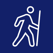 person hiking with a walking stick