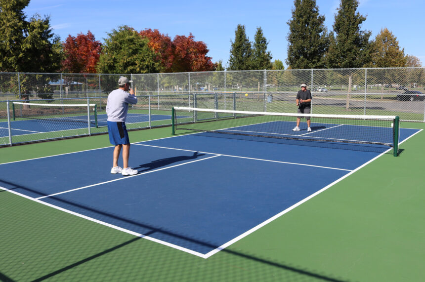 two people playing pickleball onthe pickleball court