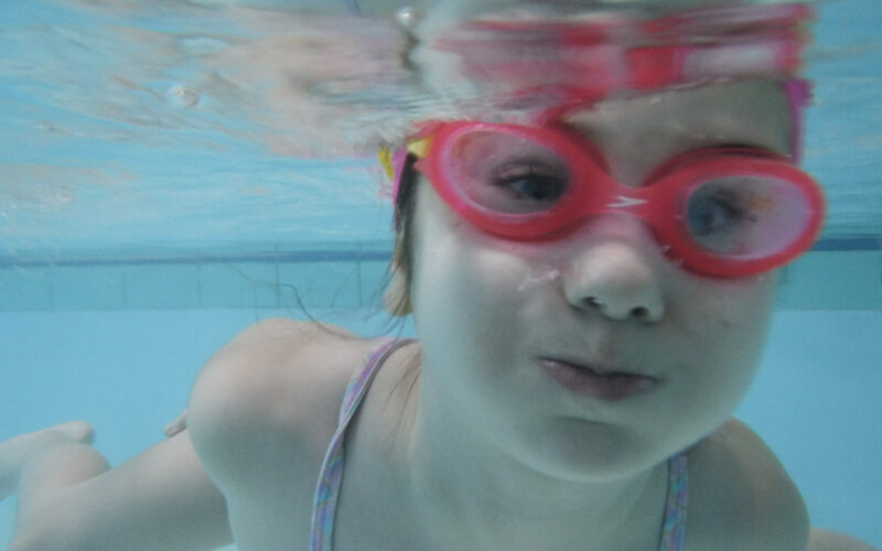 child holding breath under water